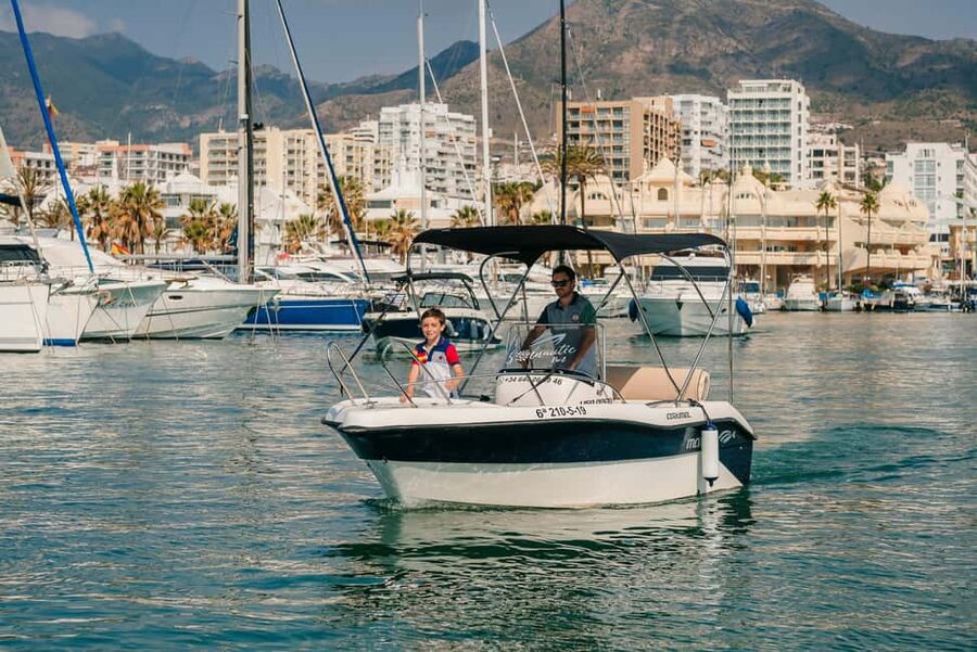 Benalmádena: license-Free Rent Boat for Dolphin Watching - Leaving Puerto Marina with the staff at the helm