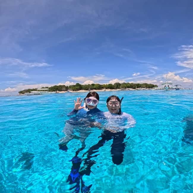 BOHOL: Dolphin Watching, Turtle Swim and Party Boat - Meeting Near Alona Beach