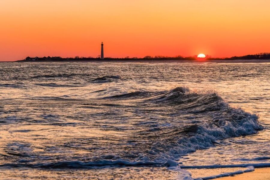 Cape May: Sunset Dolphin Cruise with Optional Wine Tastings - Cape May Lighthouse at sunset