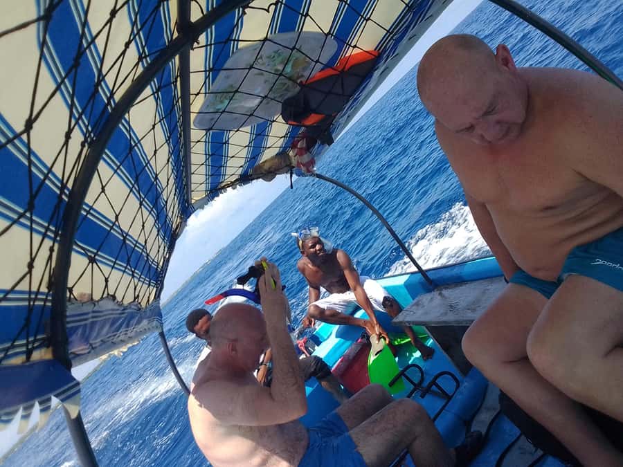 Dolphins & Snorkeling Zanzibar: Mnemba Island Tour - Language, swimming, and comfort considerations