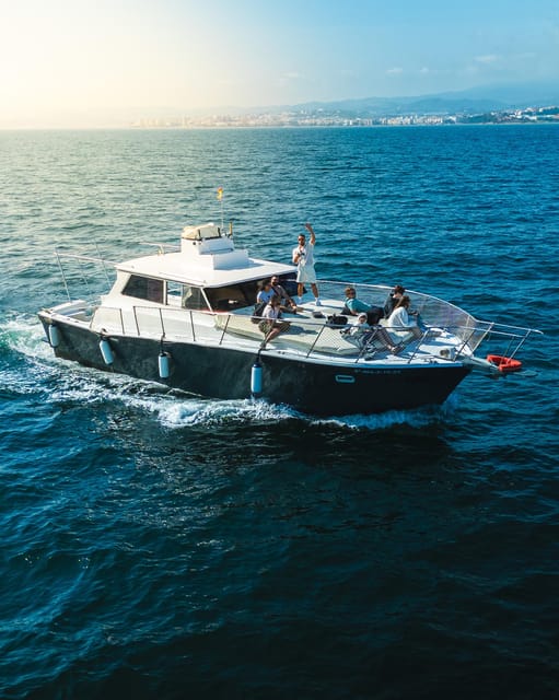 Estepona: Dolphins Searching Sea Cruise with Drink & Snacks - Snacks, drinks, and the sunset atmosphere
