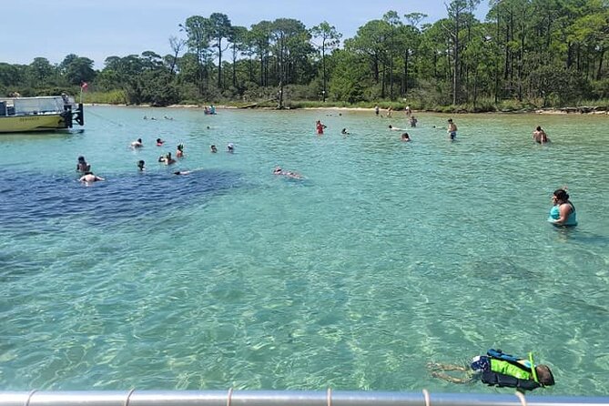 Family-Friendly Snorkeling and Dolphin Tour from FWB - Passing Crab Island and viewing the coast
