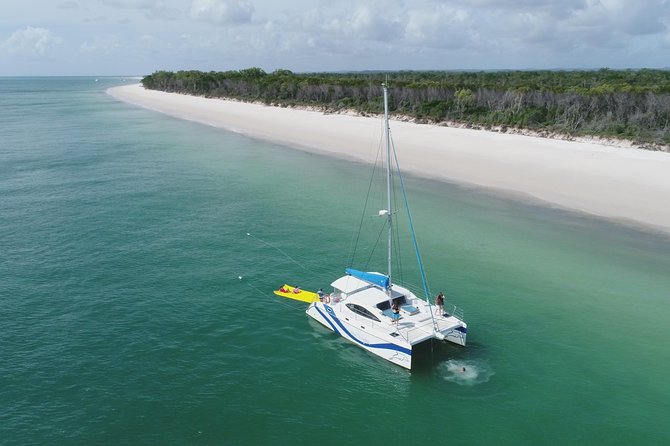 Fraser Island & Dolphin Sailing Adventure - Swimming, the aqua mat, and boom-net action