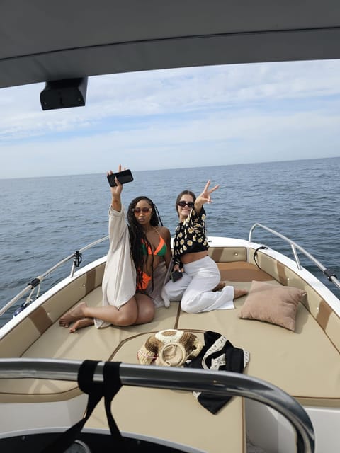 Fuengirola: Dolphin Watching Tour with Snacks and Drinks - Swimming offshore away from the beach