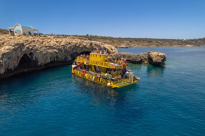Glass Bottom Boat Dolphin Cruise to Blue Lagoon and Turtle Cove - Passing Fig Tree Bay’s Shallow Water