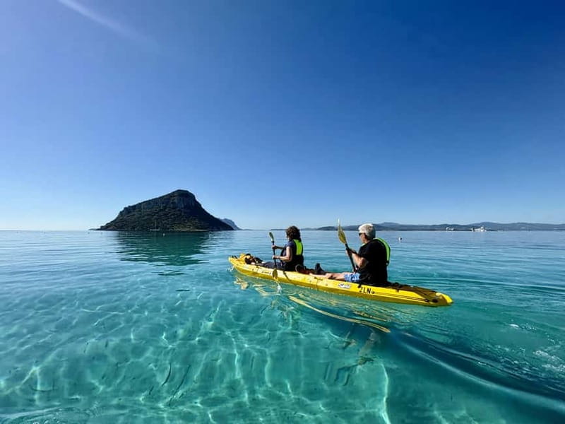 Golfo Aranci:Small group, german guided Kayak tour&Dolphins - Meeting the yellow kayaks at Spiaggia dei Baracconi