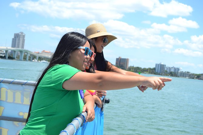 Guaranteed Dolphin Sighting Tour on Tropics Boat Tours - Upper deck, main cabin, music, and refreshments