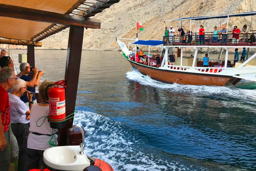 Khasab: Khor Sham Half-Day Cruise with Snorkeling & Dolphins - Leaving Khasab on a wooden dhow
