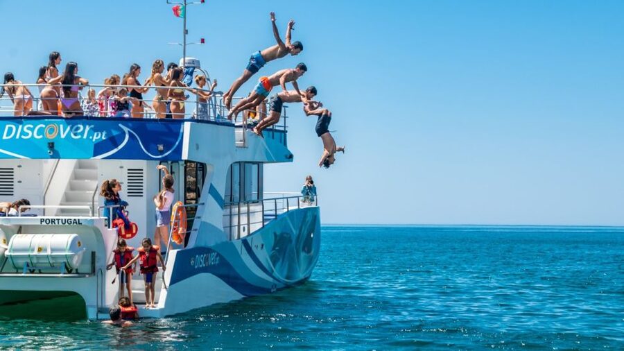 Lagos: Dolphins & Caves - Catamaran - The quiet bay, swimming, and the inflatable slide