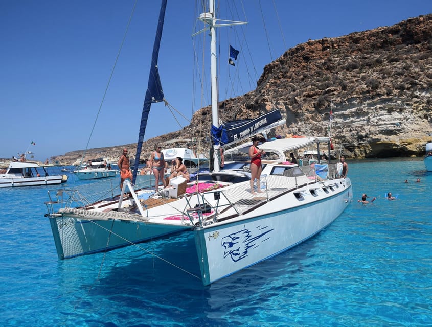 Lampedusa: Dolphin watching with aperitif at sunset - Waiting for sunset with a drink in hand