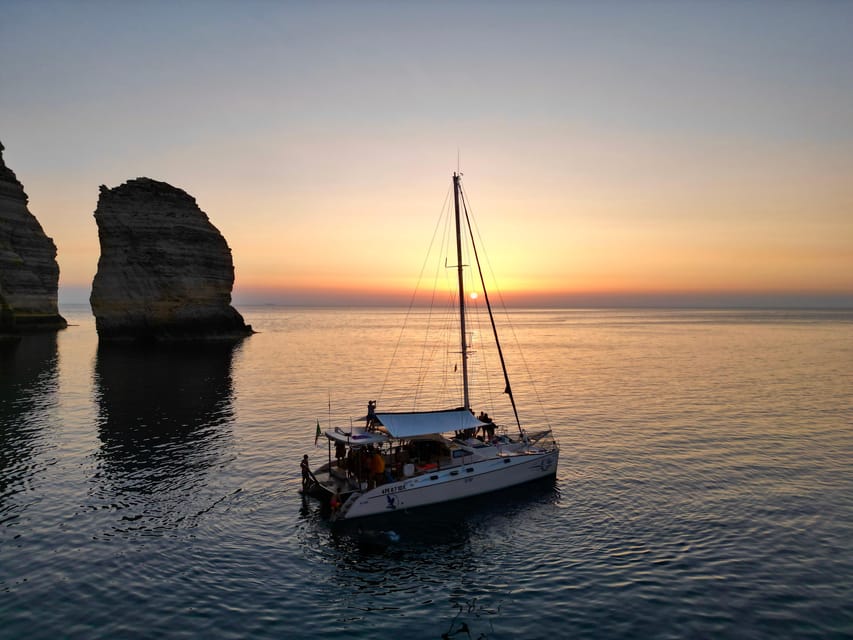 Lampedusa: Dolphin watching with aperitif at sunset - Getting into the sea at the final cove