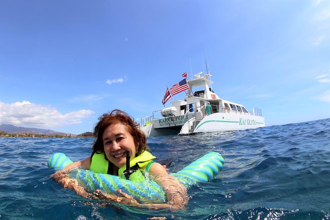 Luxury Snorkel Cruise, Local Buffet with Whale & Dolphin Watch - Snorkeling over coral and tropical fish