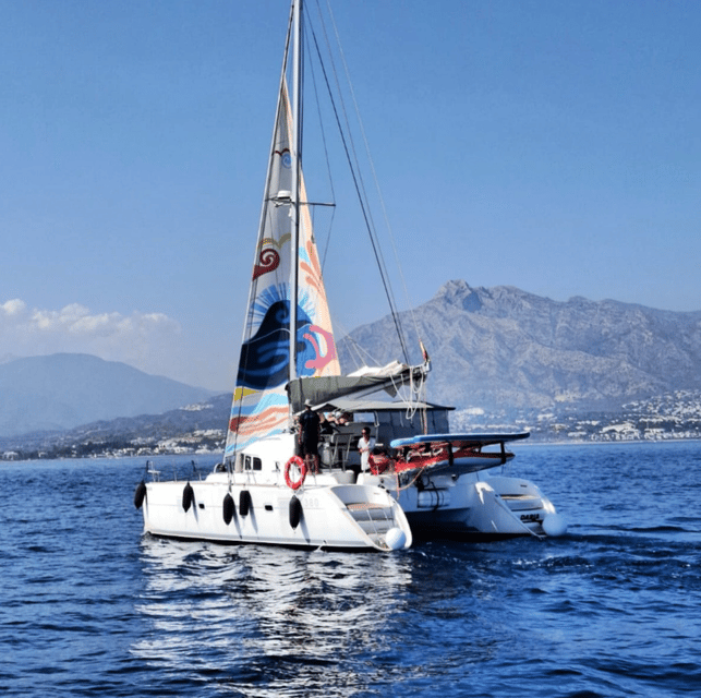 Marbella: Group Dolphin Watching Catamaran Tour with Snacks - What the two-hour cruise feels like