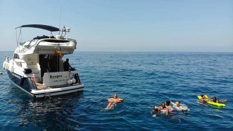 Mogan: Dolphin Watching Boat Trip with Swim Stop - Coastline views between the sightings