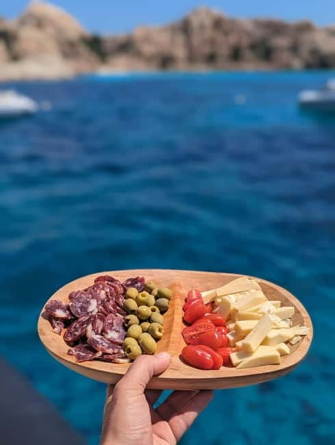 Olbia: Dolphin Watching & Snorkeling Boat Trip - The captain, guide, and onboard atmosphere