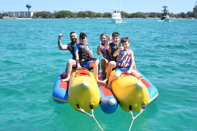 Private Banana Boat and Dolphin Spotting Experience - Getting fitted with a life jacket