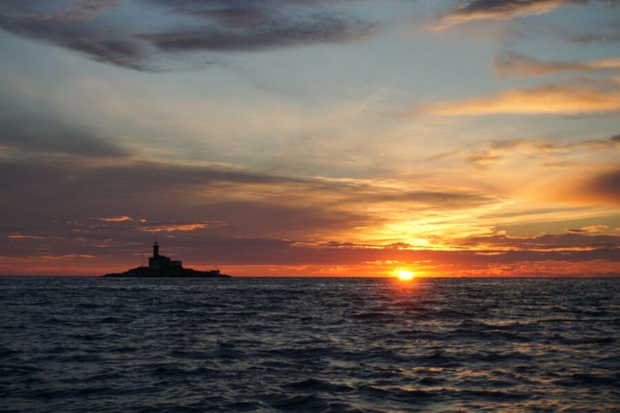 Rovinj: Sunset Boat Trip with Dolphin Watching - Leaving Valdibora as Rovinj Begins to Glow