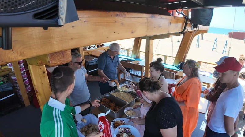 Side: Dolphin Boat Tour With Lunch Foam party Swimming - Lunch is simple, filling, and included