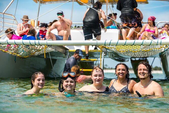 Snorkel & Dolphin Sightseeing Tour Aboard the Footloose - Boarding the Footloose at the Bayside resort