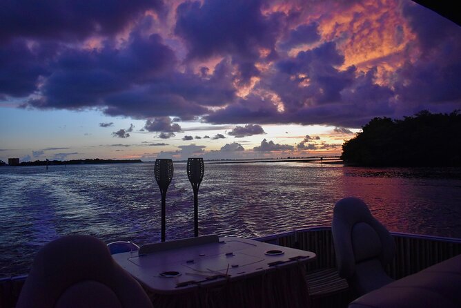 Sunset and Dolphin Cruise around Fort Myers Beach - Music, drinks, and making the boat your own