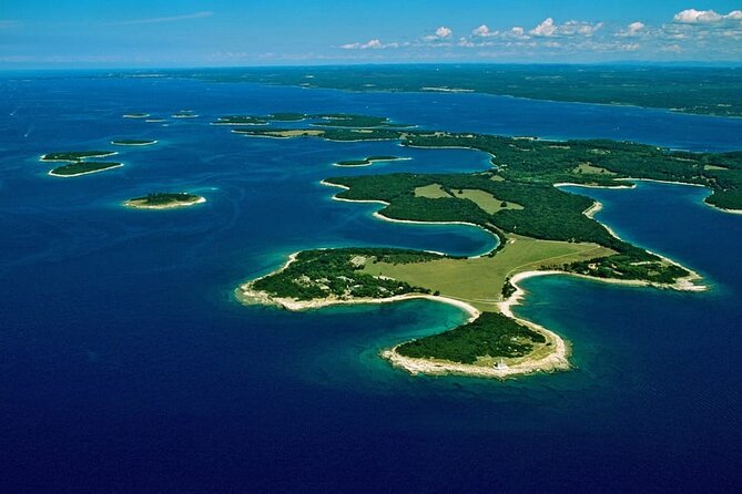 Sunset Dolphin Cruise in Brijuni National Park from Pula - Leaving Pula with the Arena at Your Back
