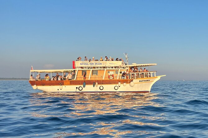 Sunset Dolphin Cruise in Brijuni National Park from Pula - The Return View of Illuminated Pula Arena