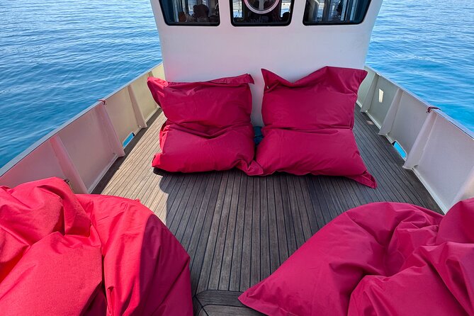 Sunset with dolphins on a vintage tugboat in Golfo Aranci - Why the vintage tugboat matters