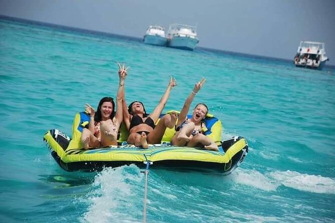 Swimming with Dolphins and Banana Boat Sea Trip Day Experience - Hurghada - The boat atmosphere: friendly crew, loud music