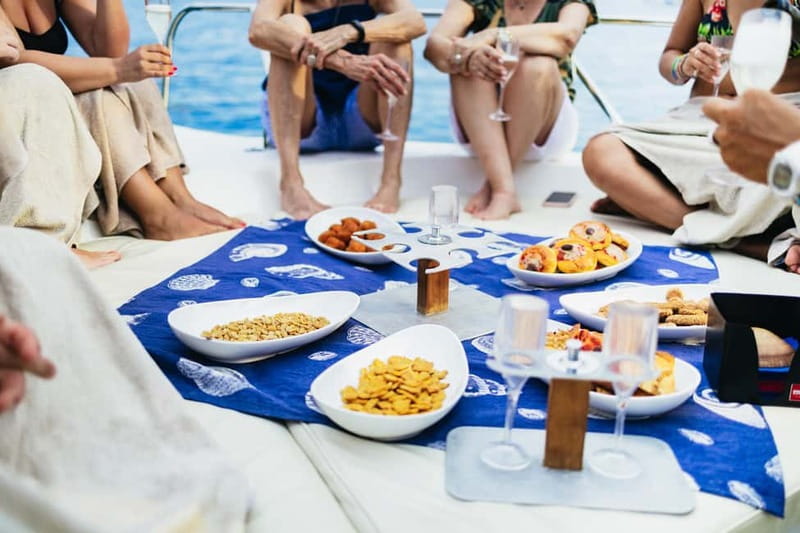 Taormina: Sunset Boat Tour with Dolphin Watching & Aperitif - Snacks, drinks, and the sunset ride home