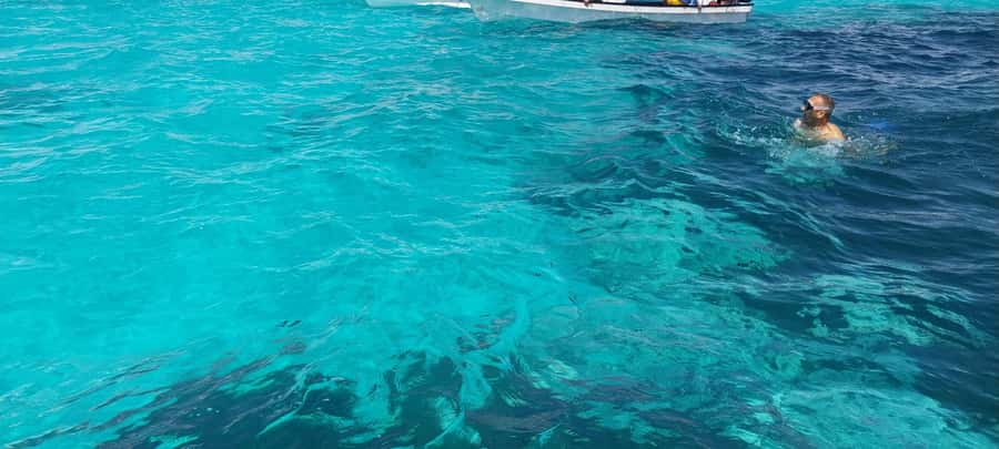 Zanzibar: Mnemba Island Dolphin and Snorkeling Tour - Guides, boats, and the human side of the trip